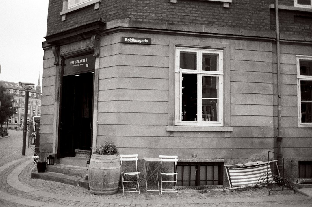 Portrait of an elderly Danish man sitting outside a local cafe