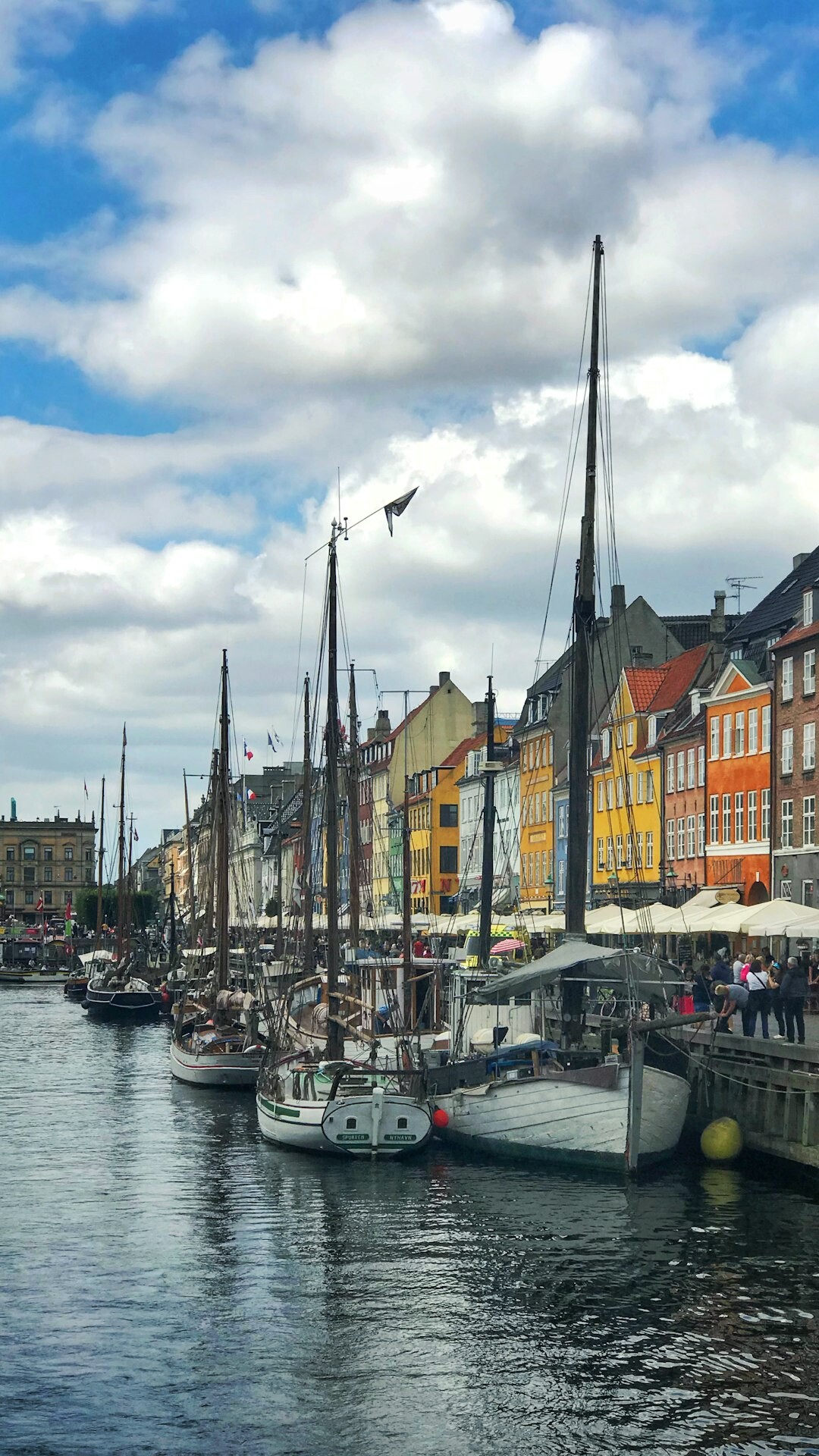 Small harbor town in Denmark with fishing boats docked at the quay
