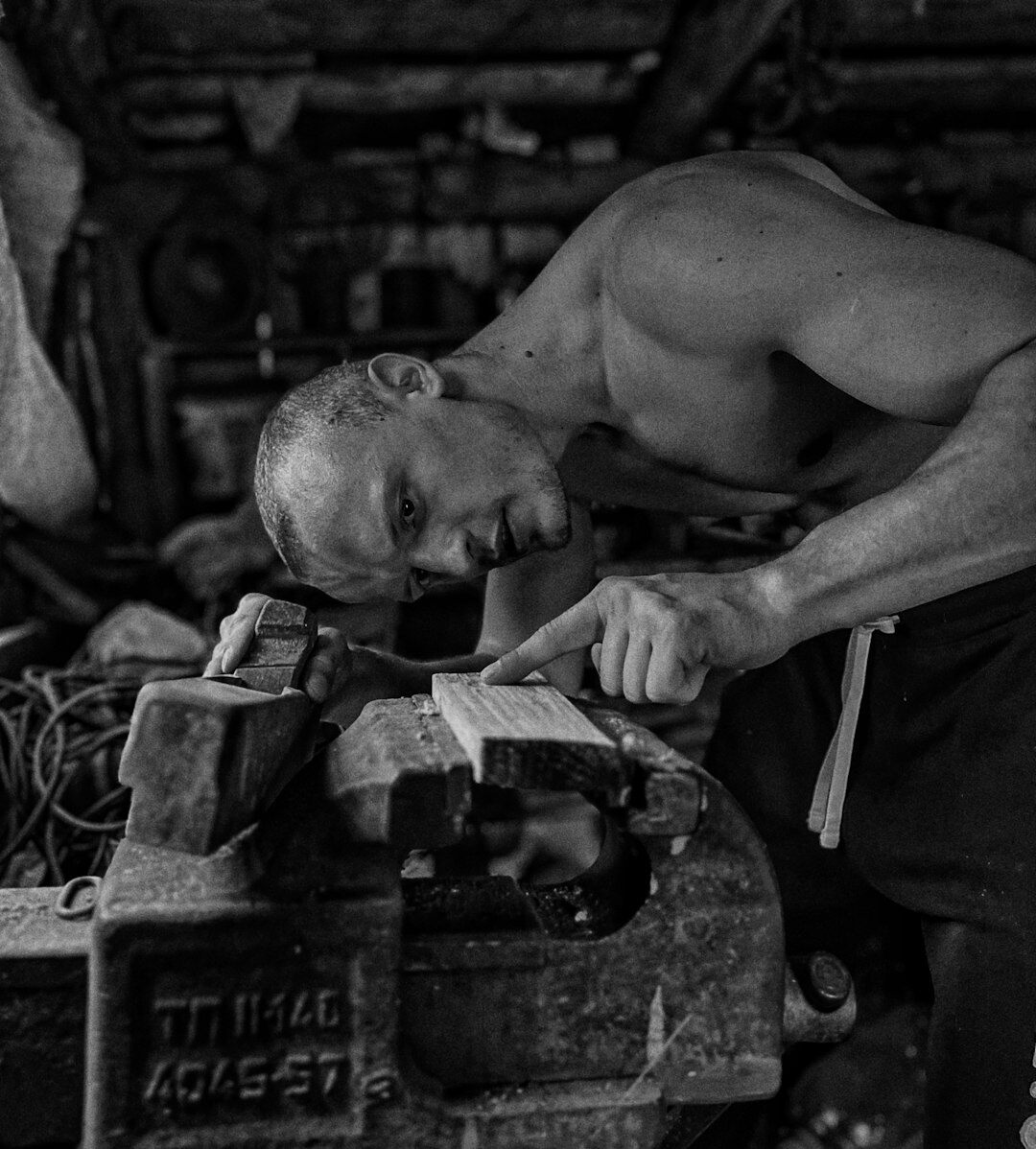 blacksmith hammering iron