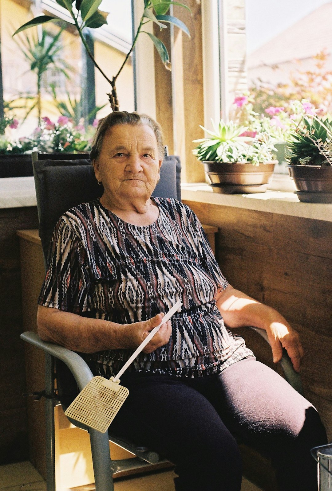 elderly woman knitting